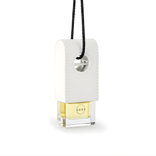 Car air freshener with a white holder and black strap on a white background